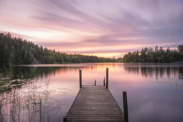 Foto op Canvas Long exposure by a lake with a jetty © Christian