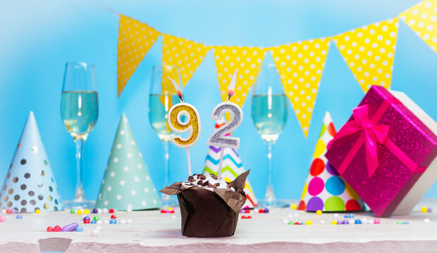 Date of birth for woman or girl with birthday box. Pie with number of candles  92. Anniversary greeting card with champagne. Holiday decorations. Happy birthday