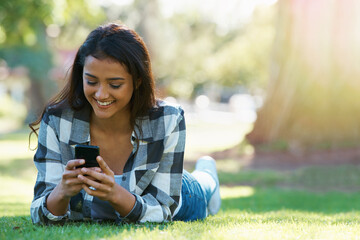 Grass, phone or happy woman in park for social media to chat on internet post or website...