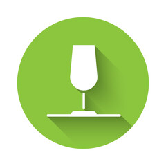 White Wine glass icon isolated with long shadow background. Wineglass sign. Green circle button. Vector
