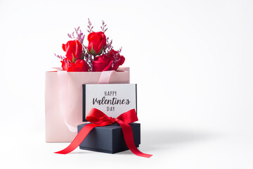 Happy valentine's day card with black gift box and rose bouquet in paper bag isolated on white...