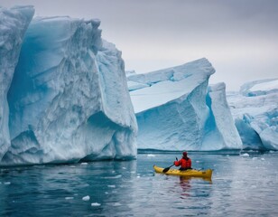 A lone kayaker among huge Arctic icebergs.