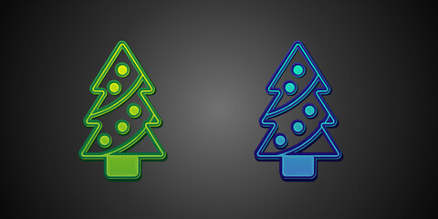 Green and blue Christmas tree with decorations icon isolated on black background. Merry Christmas and Happy New Year. Vector