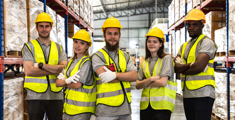 Group of diversity factory warehouse men and women workers working together in contribution...