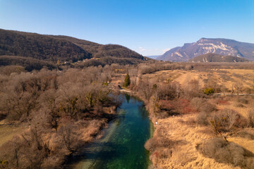 Kayak trip on the Lac du Bourget in Aix-Les-Bains, with aerial view by dorne of the canal from Savières to Chatillon, between castle, mountains and river in Savoie
