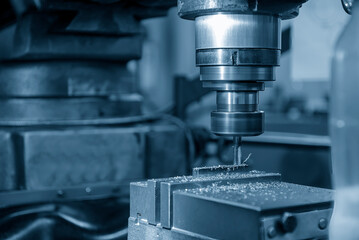 The slot cutting  process on NC milling machine with flat end mill tools.