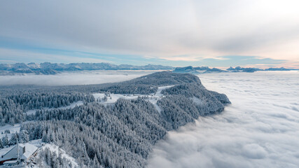 Fototapeta na wymiar drone flight over the snow-capped mountains of Revard in Aix-Les-Bains in Savoie