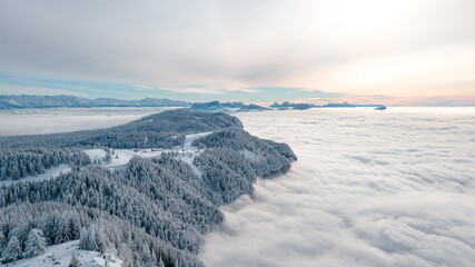drone flight over the snow-capped mountains of Revard in Aix-Les-Bains in Savoie