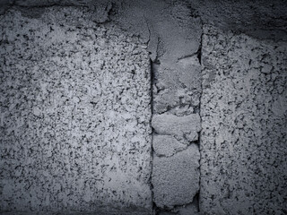 Old bare gray brick wall for a vintage background, close-up shot