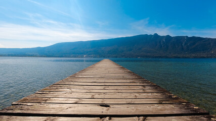 Photo of the Lac du Bourget and the Dent du Chat, in Aix-Les-Bains in Savoie, France - obrazy, fototapety, plakaty