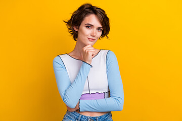 Fototapeta premium Photo of smart clever woman wear top smiling thinking arm chin isolated yellow color background