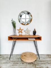 A rectangular hardwood table with a mirror, made of natural wood, serving as furniture in the room.