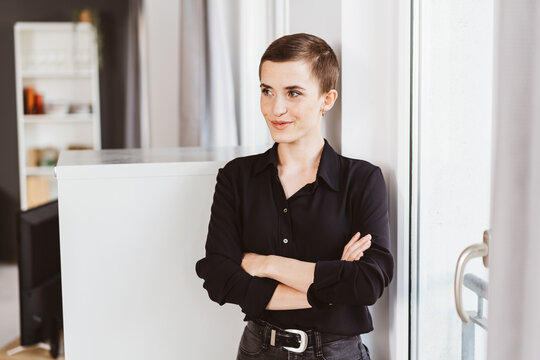 Thoughtful Young Woman Contemplating Future Endeavors in Office Space