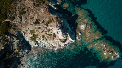 Drone photography genoise tower, cala and barcaggio beach with turquoise waters in Cap Corse 