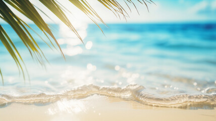 Fototapeta na wymiar White sand of a tropical beach, palm leaves and bokeh highlights