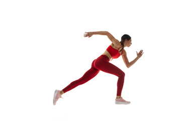 Fototapeta na wymiar Side view. Athletics. Motivated woman in motion, running, training against white studio background. Tournament. Concept of sport, active and healthy lifestyle, sportswear, competition