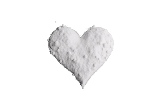 White powder in shape heart cocaine line isolated on black background top view series
