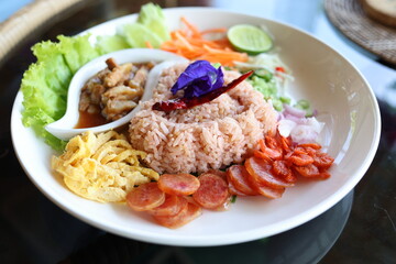 Thai food named Khao Kluk Shrimp Paste It was beautifully arranged in a white plate. Looks delicious. Thailand food concept - obrazy, fototapety, plakaty