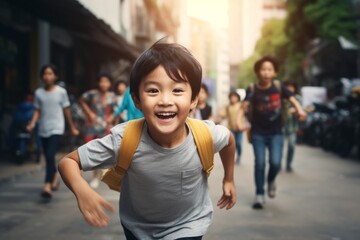 happy asian child boy running on the background of a crowd of people