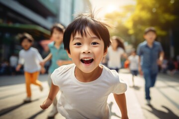 happy asian child boy running on the background of a crowd of people