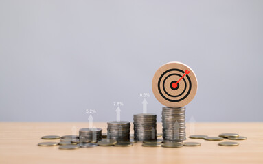 Concepts of interest rates, dividends Income and investment return, row of coins and arrows showing...
