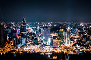 Aerial drone photo - Skyline of Saigon (Ho Chi Minh City) at night. Vietnam