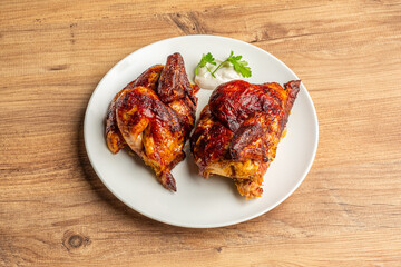 Top View photo of a grilled chicken dish on a wooden floor