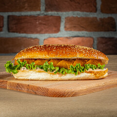 Supreme chicken sandwich on a wooden floor