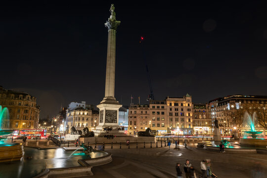 London. UK- 02.04.2024. A night time general view of Trafalgar Square showing Nelson's Column and the water fountains.