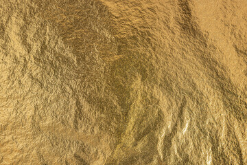 Texture Of Gold Foil Shiny Glitter Background