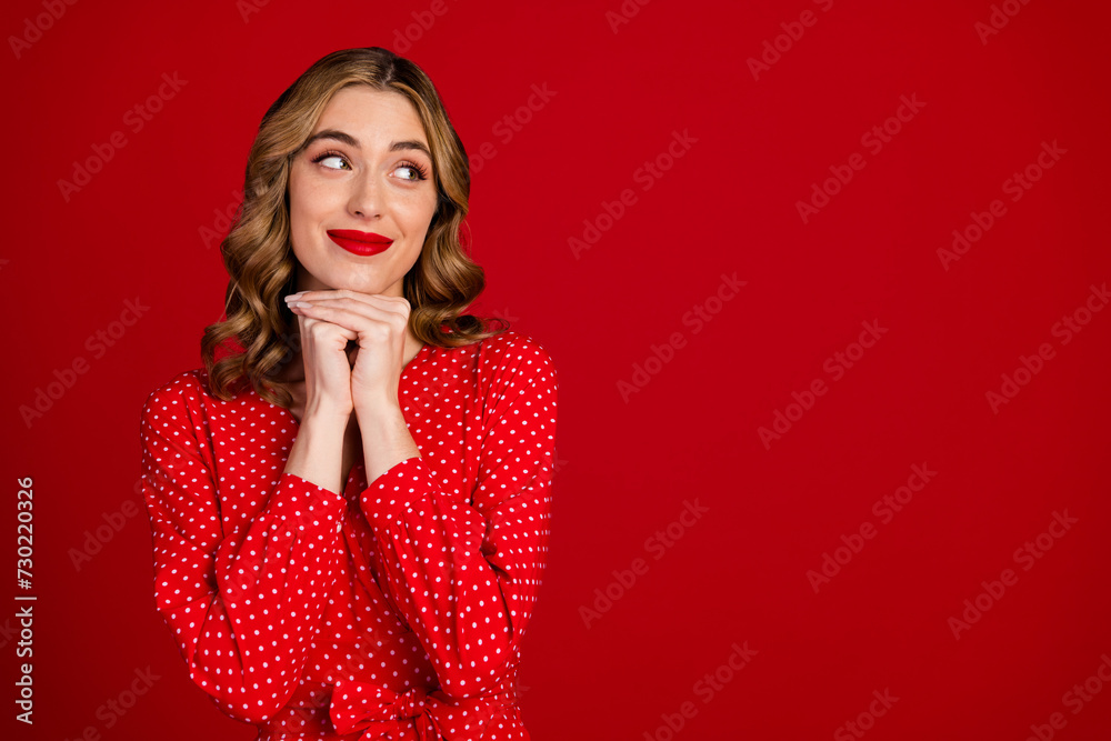 Sticker Portrait of gorgeous minded girl look empty space christmas event isolated on bright red color background