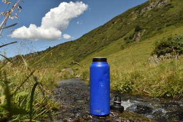  Blue Reusable Water Bottle by Mountain Stream in Sunny Hillside Environment - 730221109