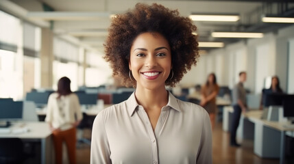 Portrait of smiling millennial Afro-American businesswoman standing in office and looking at camera. headshot of happy HR manager. Friendly business team, good colleagues. employee appreciation day - obrazy, fototapety, plakaty