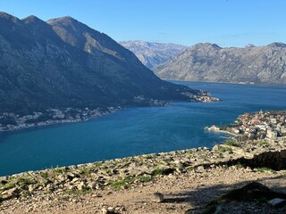 Fototapeta premium House stones Bay waves mountains Montenegro Kotor city