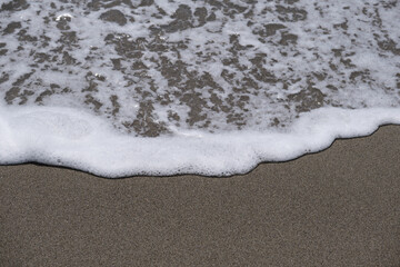 beautiful beach, close up. aerial view of a beautiful beach with sand and sea by day in high resolution. Top-down aerial view of a clean white sandy beach on the shores of a beautiful sea.