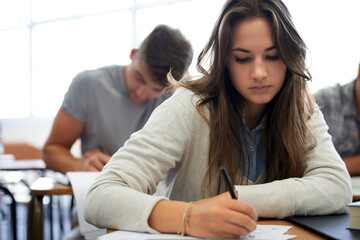 University, writing and woman in classroom with notebook for development in learning, opportunity...