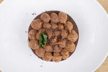 Chocotorta. Top view of a cake made with chocolate biscuits and dulce de leche cream, in a white dish.