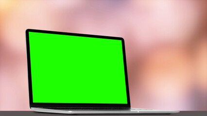 a modern laptop computer on the table on the boke background