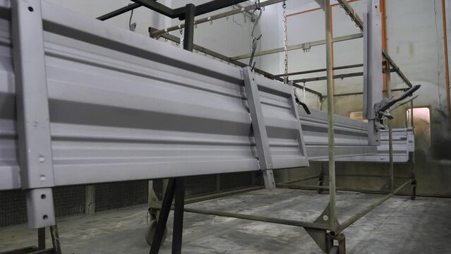 Painted metal parts for a trailer in the workshop.