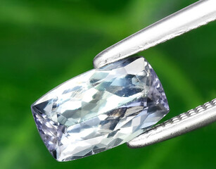 natural blue tanzanite gem on the background