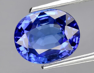 natural intense blue tanzanite gem on the background