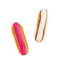 French eclairs on a white plate isolated on white background