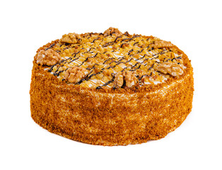 Cake with walnuts and honey on white