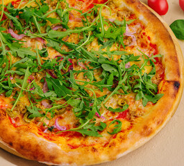 pizza with arugula and pizza with cheese and pepper
