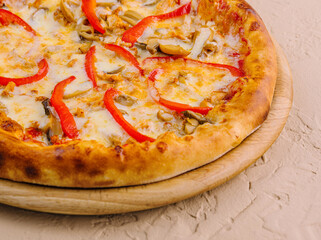 Delicious pizza with chicken, pepper and mushrooms