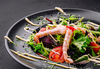 Healthy salad with shrimps close up