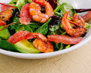 Healthy fresh salad with shrimps, avocado and grapefruit