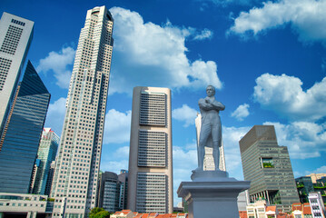 Fototapeta na wymiar Singapore city skyline of business district downtown on blue sky with cloud in daytime.