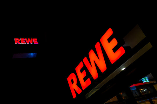 bamberg, bavaria, germany - 17 01 2024: a rewe supermarket in the evening