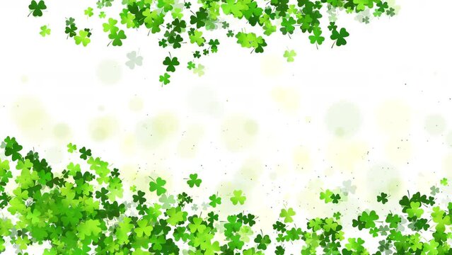 Saint Patricks day background with sprayed clover shamrocks. Green frame of leaves on white looped background. Copy space.